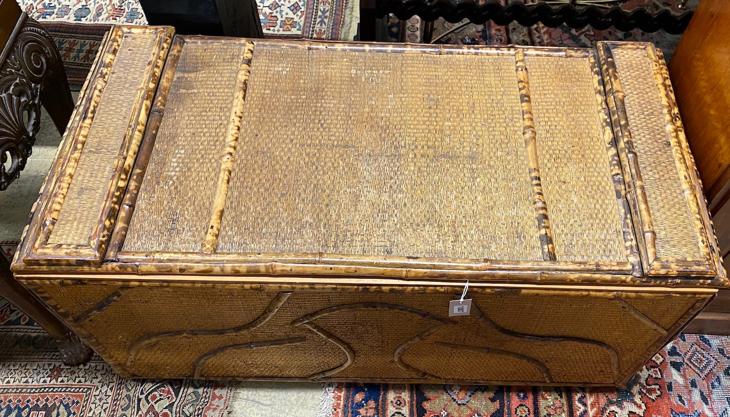 An early 20th century bamboo and rattan trunk, width 110cm, depth 52cm, height 56cm